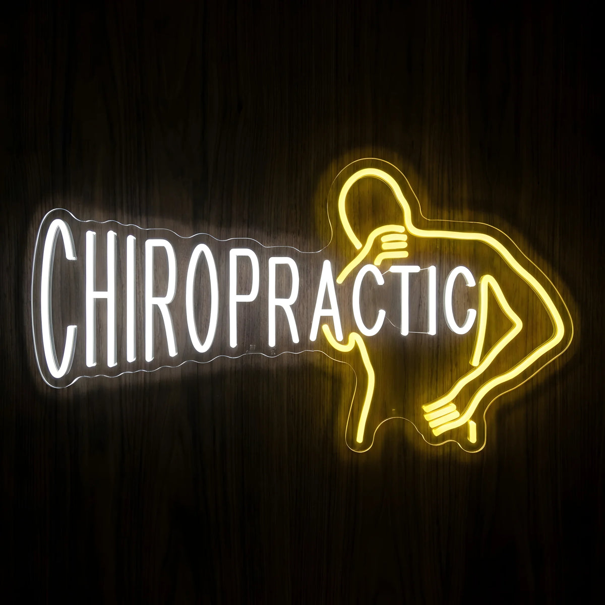 Chiropractic Back Pain LED neon sign featuring cool white CHIROPRACTIC lettering and a yellow outline of a person holding their lower back on clear acrylic backing for chiropractic office wall decor.