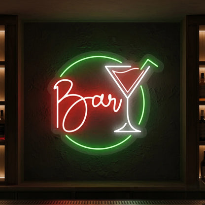Photo of the 'Cocktail Bar' neon sign glowing in multi-color against a dark textured wall.