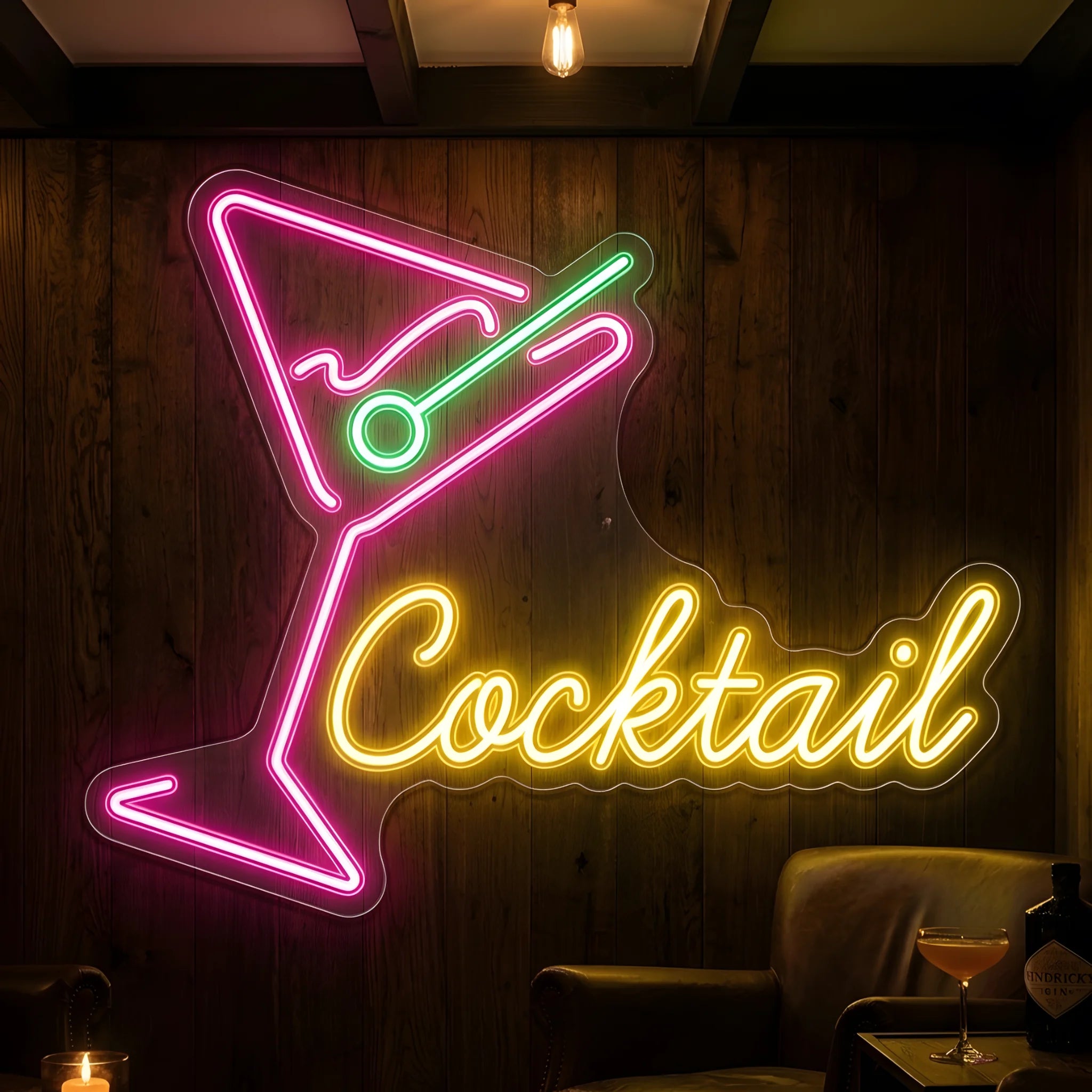 Photo of the 'COCKTAIL' neon sign glowing in multi-color against a styled interior wall.