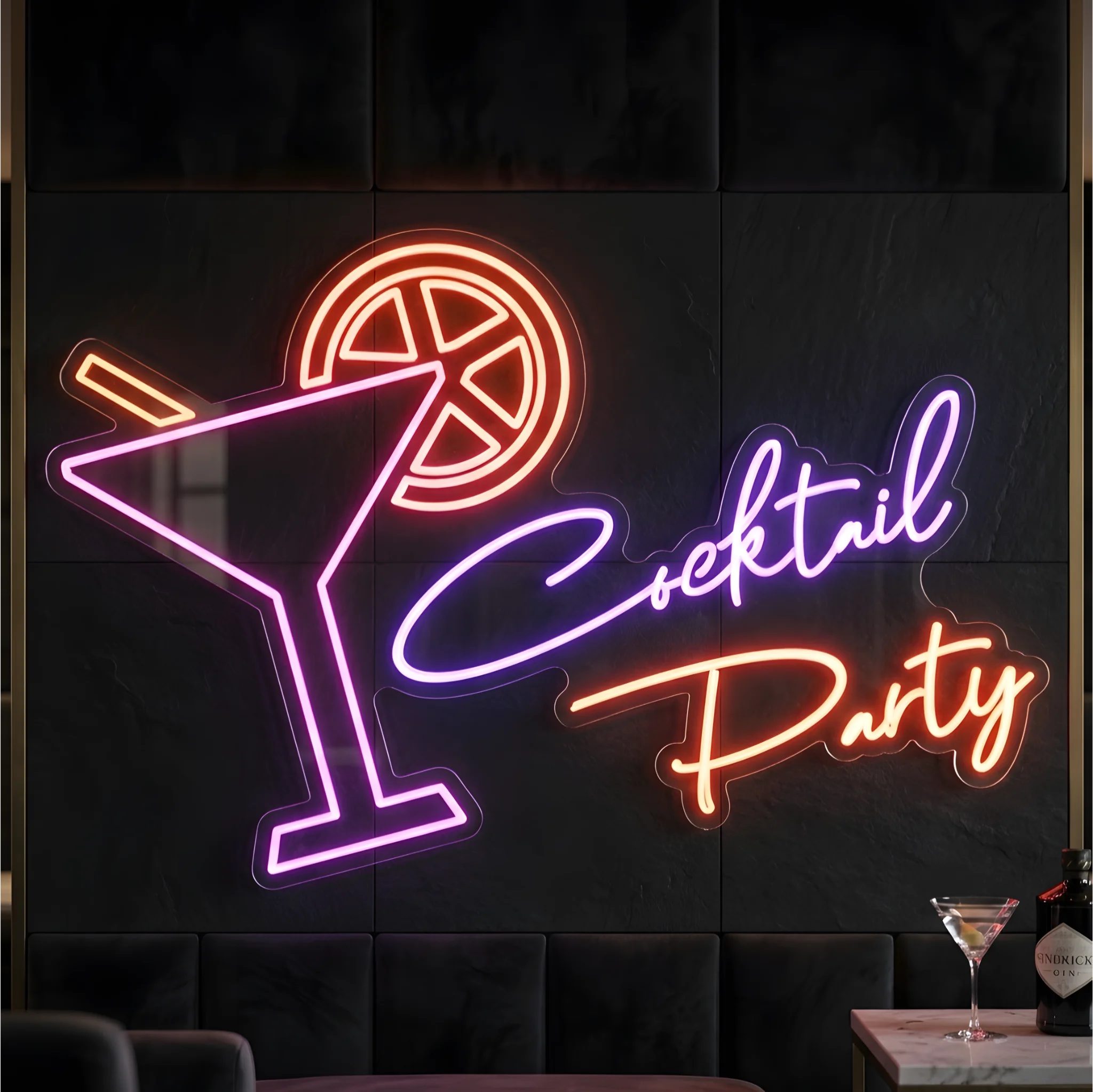 Photo of the 'Cocktail Party' neon sign glowing in multi-color against a styled interior wall.