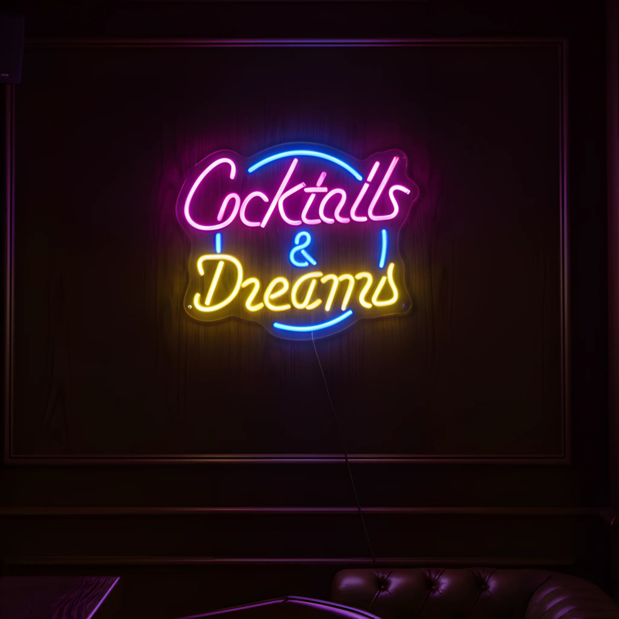 Photo of the 'Could Be Water Could Be Vodka' neon sign glowing in multi-color against a modern bar-inspired wall.