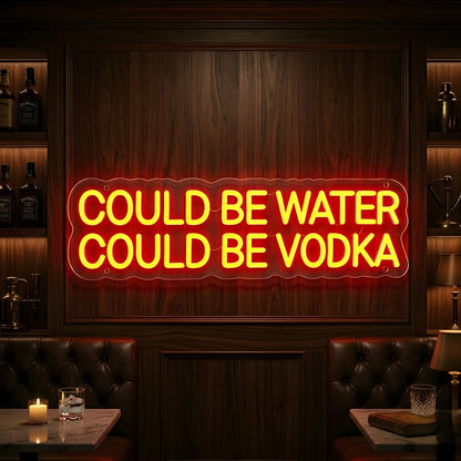 Photo of the 'Could Be Water Could Be Vodka' neon sign glowing in orange against a modern bar-inspired wall.