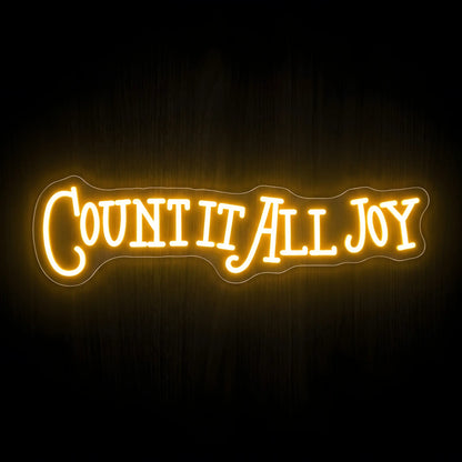 Count It All Joy LED neon sign with warm golden illumination on precision-cut acrylic backing, inspirational Christian wall decor inspired by James 1:2.