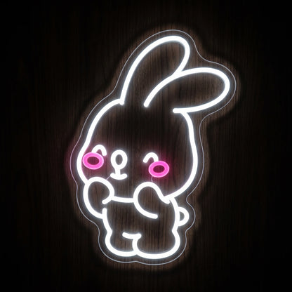 Cute bunny LED neon sign with bright white outline, pink cheeks, and clear acrylic backing.
