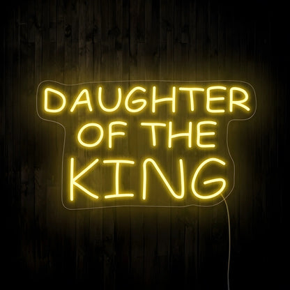 Daughter of the King LED neon sign with warm white illumination on precision-cut acrylic backing, Christian wall decor featuring an inspirational faith quote.