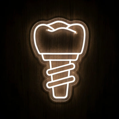 Dental Implant LED neon sign featuring a glowing warm white dental implant and screw outline on precision-cut clear acrylic backing mounted against a dark wooden wall.