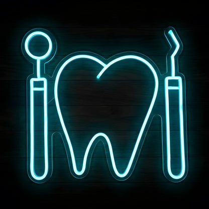 Dental Mirror and Scaler LED neon sign featuring a large cyan-blue tooth outline between a dental mirror and scaler on clear acrylic backing for dental clinic wall decor.