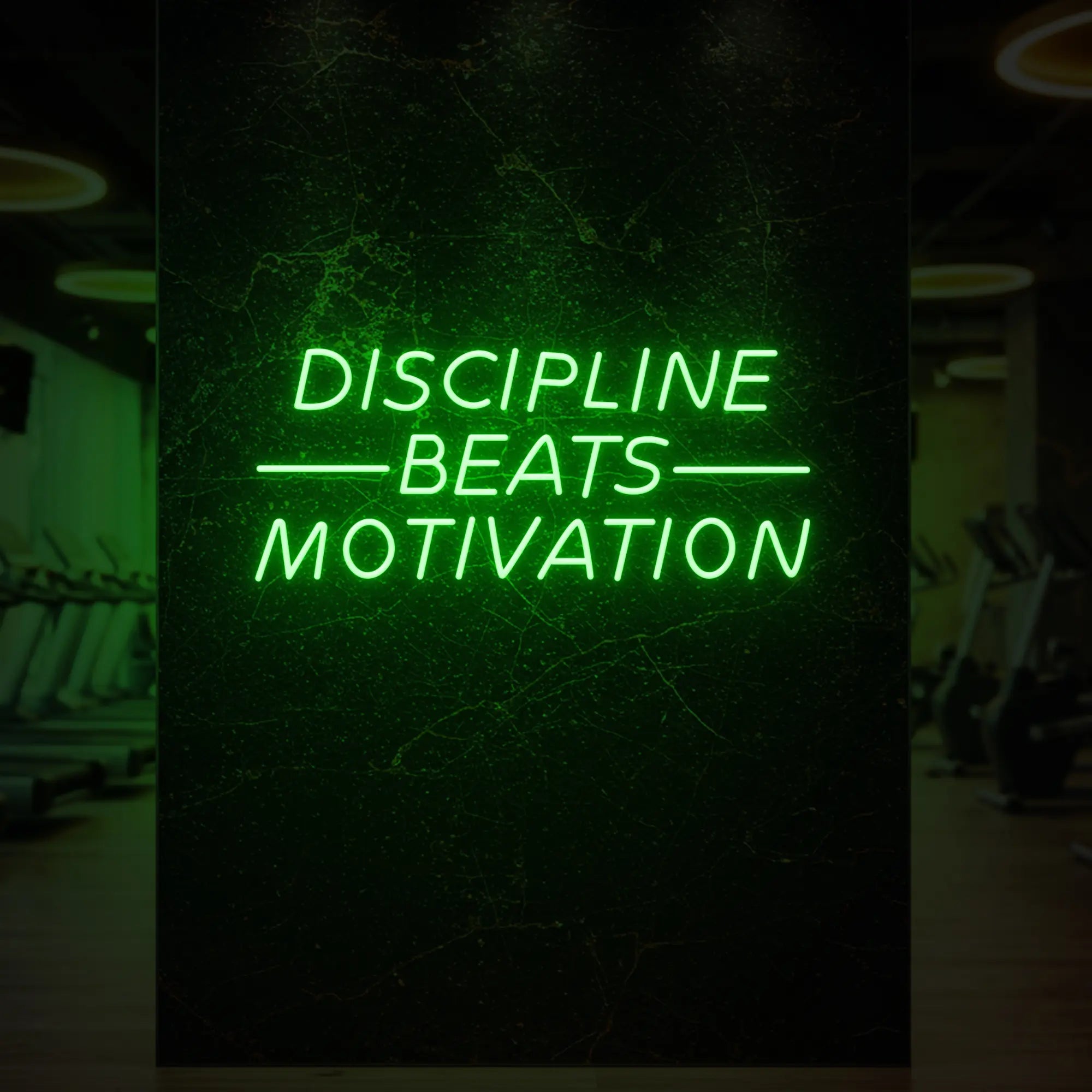 'Discipline Beats Motivation' neon sign glowing in green against a styled interior wall.