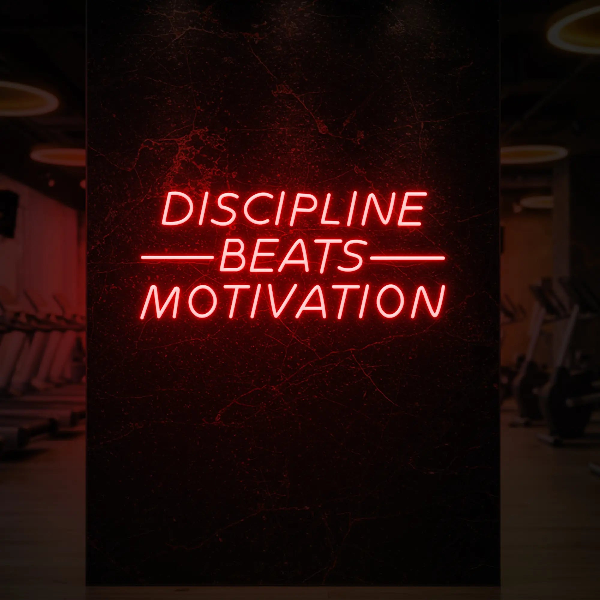 'Discipline Beats Motivation' neon sign glowing in red against a styled interior wall.