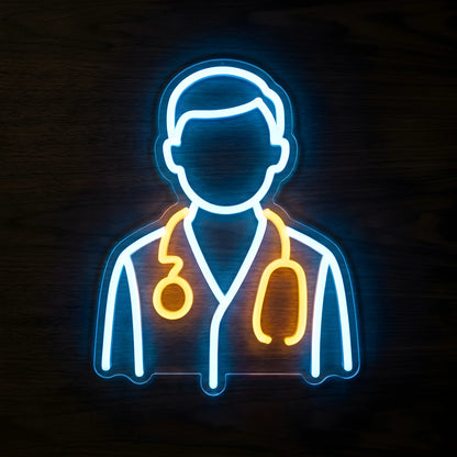 Doctor Medical Uniform LED Neon Sign featuring a minimalist doctor silhouette outlined in blue and white neon with a glowing yellow stethoscope on clear cut-to-shape acrylic against a dark wooden wall.