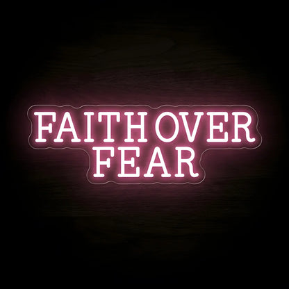 Faith Over Fear LED neon sign with soft pink illumination on precision-cut acrylic backing, Christian wall decor featuring an inspirational faith message.