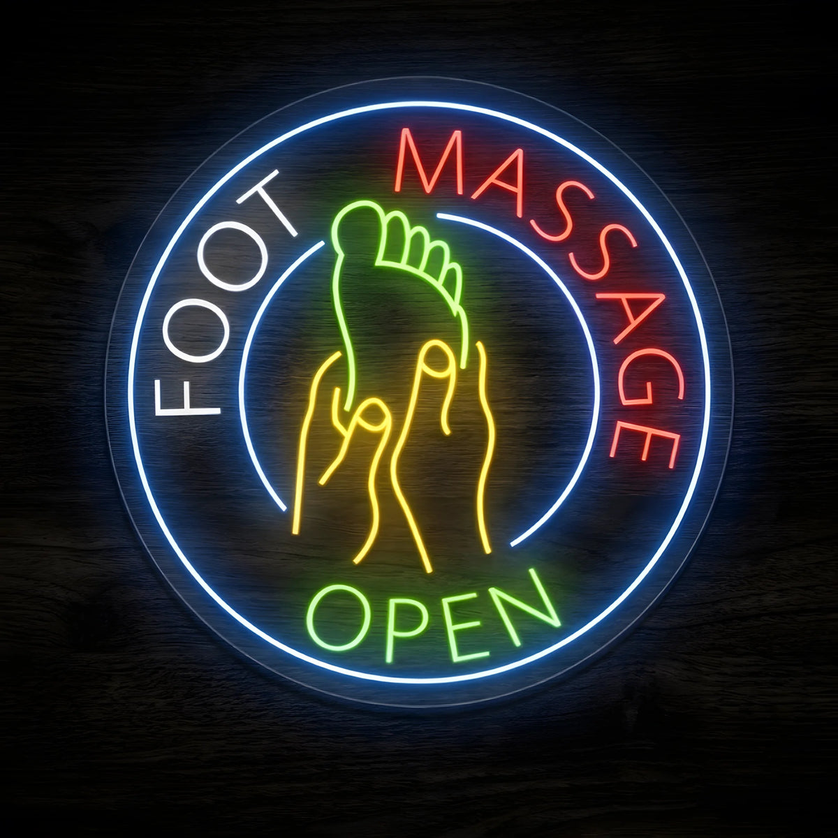 Foot Massage Open LED Neon Sign featuring a green foot being massaged by yellow hands, white FOOT lettering, red MASSAGE lettering, green OPEN text, and a glowing blue circular border against a dark wooden wall.