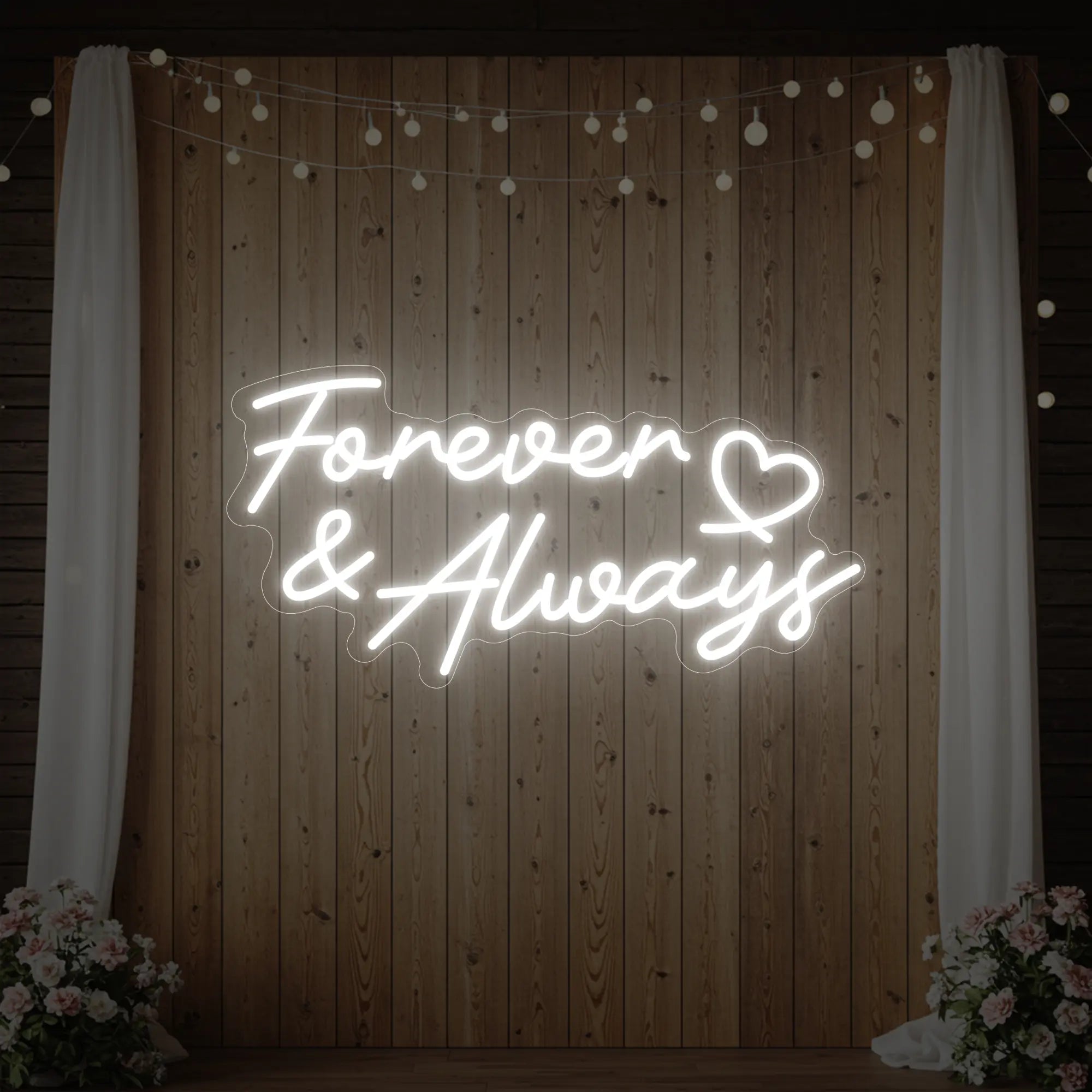 Photo of the 'Forever & Always' neon sign glowing in cool white against a styled interior wall.