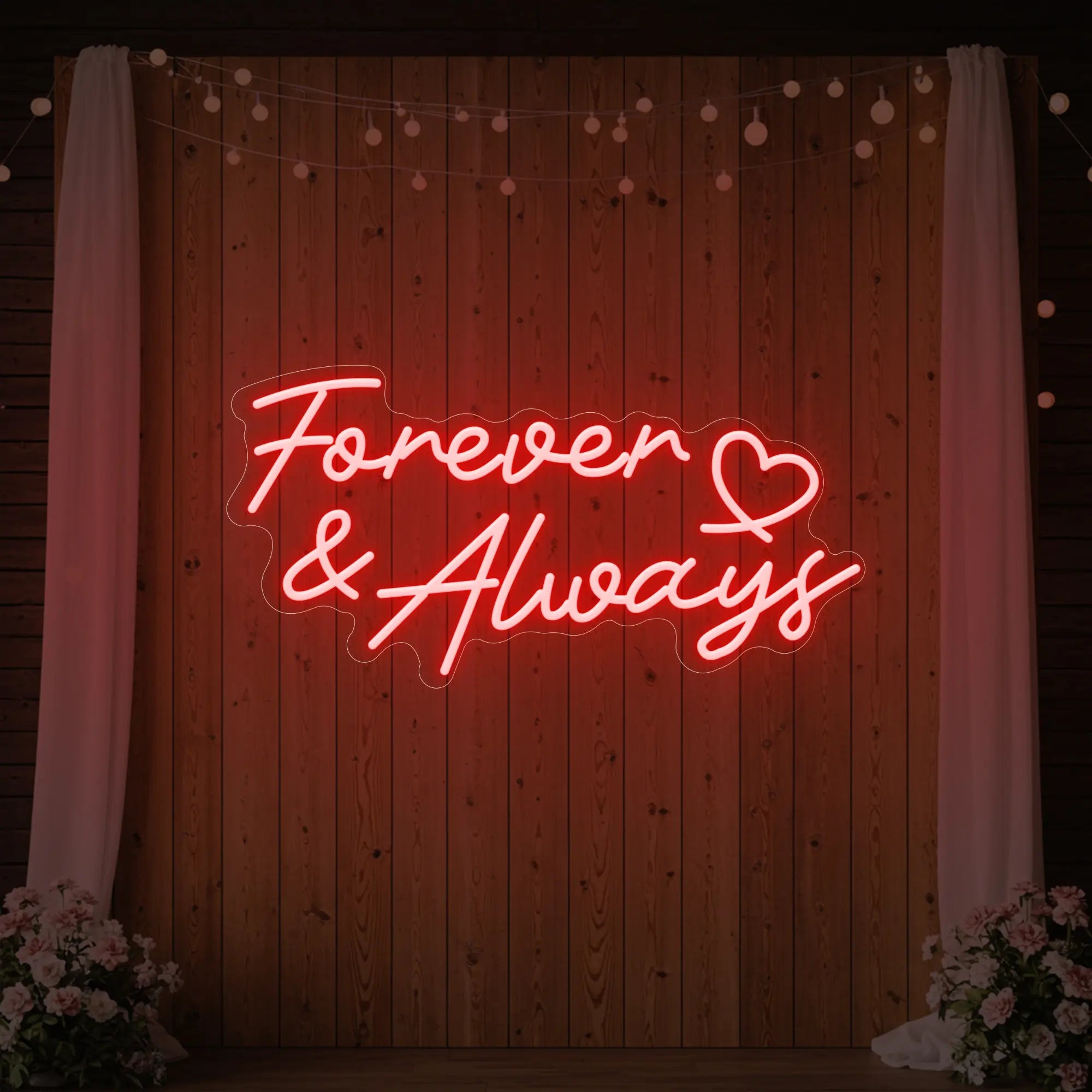 Photo of the 'Forever & Always' neon sign glowing in red against a styled interior wall.
