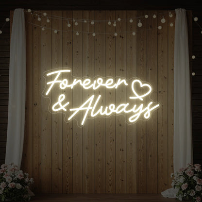 Photo of the 'Forever & Always' neon sign glowing in warm white against a styled interior wall.