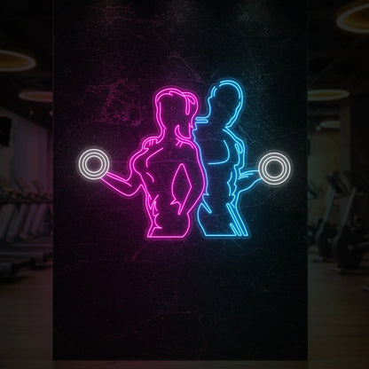  'Girl & Guy Lifters' neon sign glowing in light pink, ice blue and cool white against a styled interior wall.
