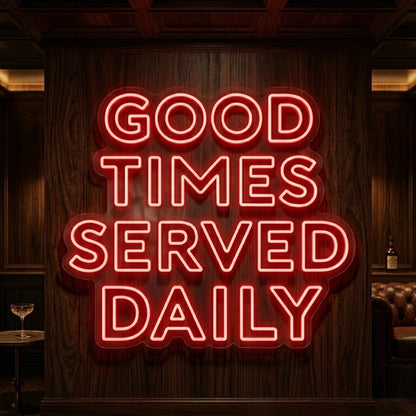 Photo of the 'Good Times Served Daily neon sign glowing in red against a styled interior wall.