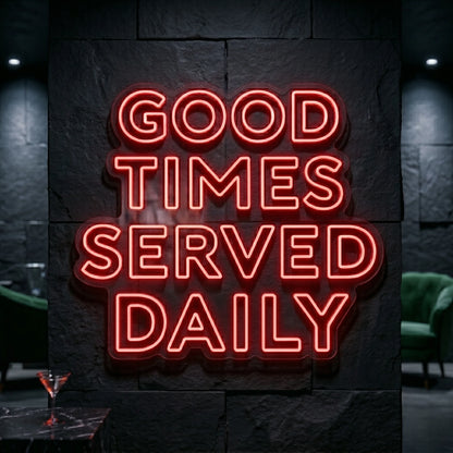 Photo of the 'Good Times Served Daily neon sign glowing in red against a styled interior wall.