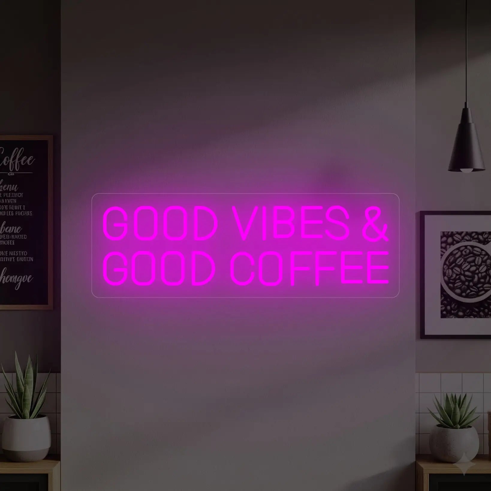 Photo of the 'GOOD VIBES & GOOD COFFEE' neon sign glowing in deep pink against a styled interior wall.