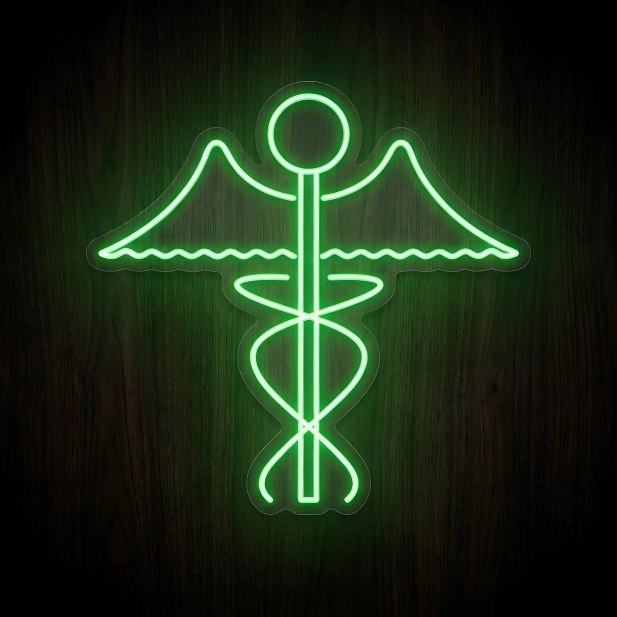 Green Caduceus Medical Symbol LED Neon Sign featuring a glowing green winged medical staff with intertwined serpentine lines on clear cut-to-shape acrylic against a dark wooden wall.