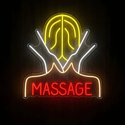 Healing Hands Massage LED Neon Sign featuring white hands, a glowing yellow wellness symbol, and red MASSAGE lettering on clear acrylic against a dark wooden wall.