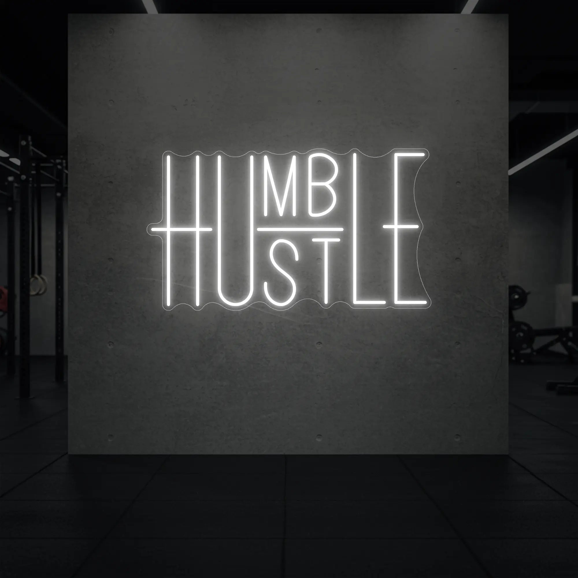  'Humble Hustle' neon sign glowing in cool white against a styled interior wall.