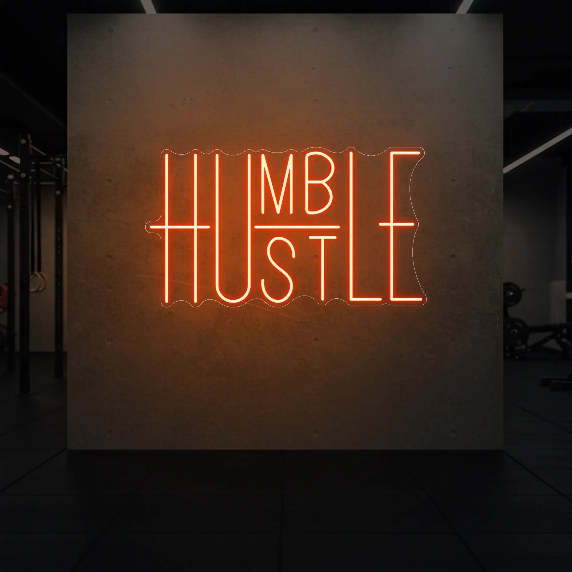 'Humble Hustle' neon sign glowing in golden yellow against a styled interior wall.