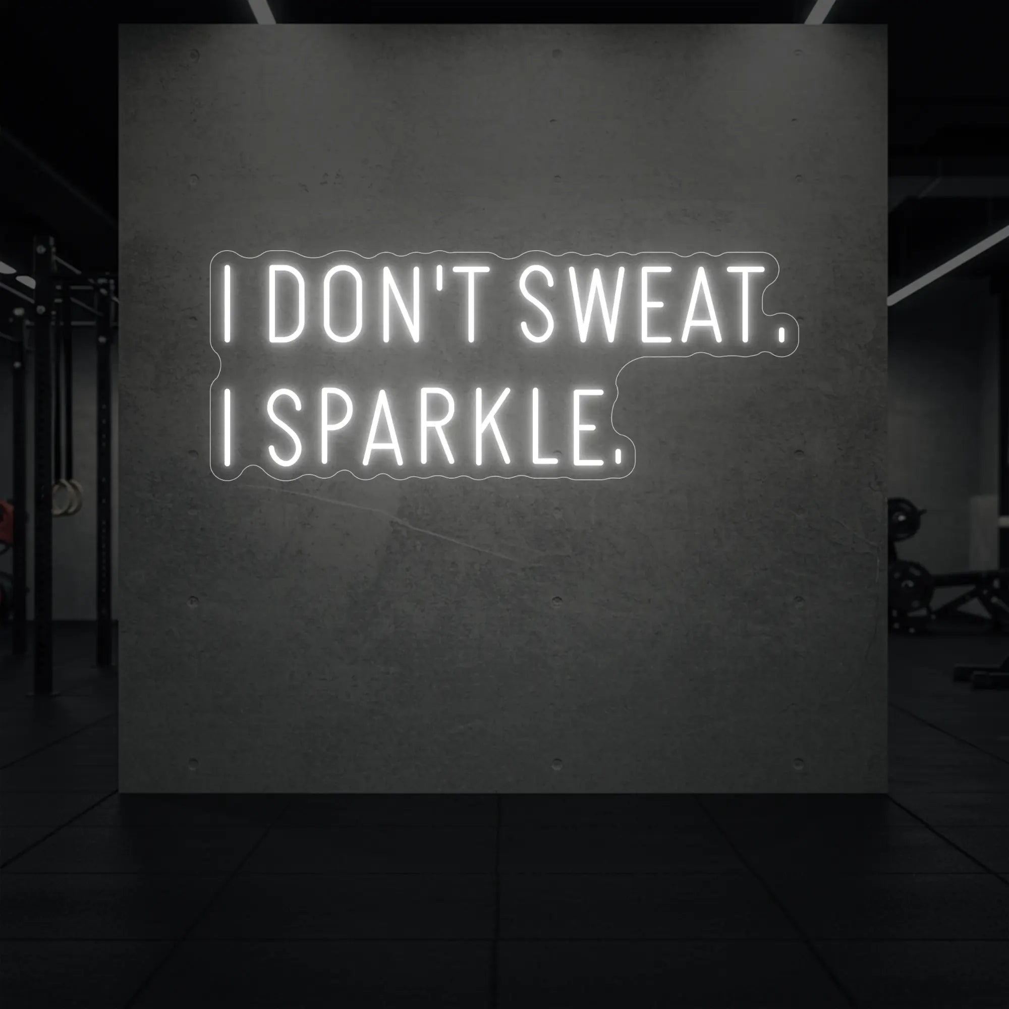 'I DON'T SWEAT. I SPARKLE.' neon sign glowing in cool white against a styled interior wall.