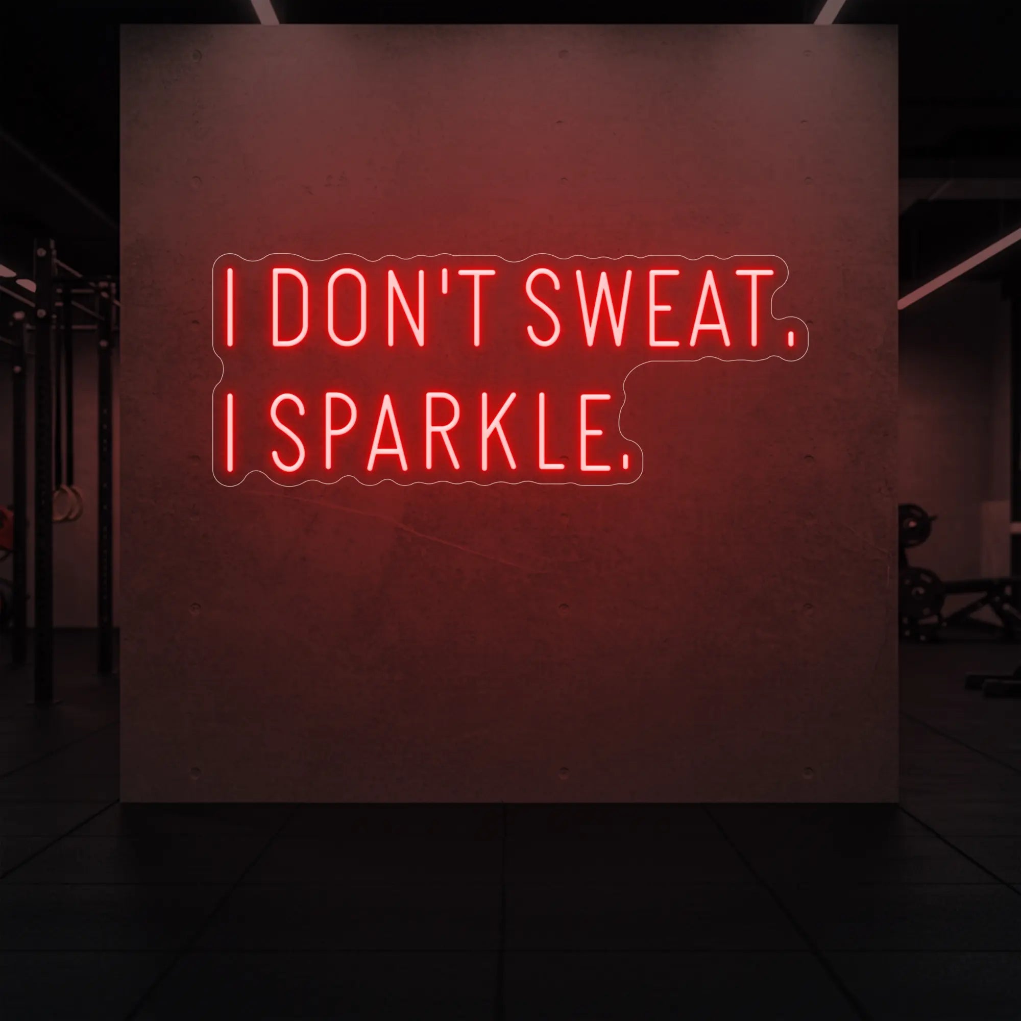 'I DON'T SWEAT. I SPARKLE.' neon sign glowing in red against a styled interior wall.