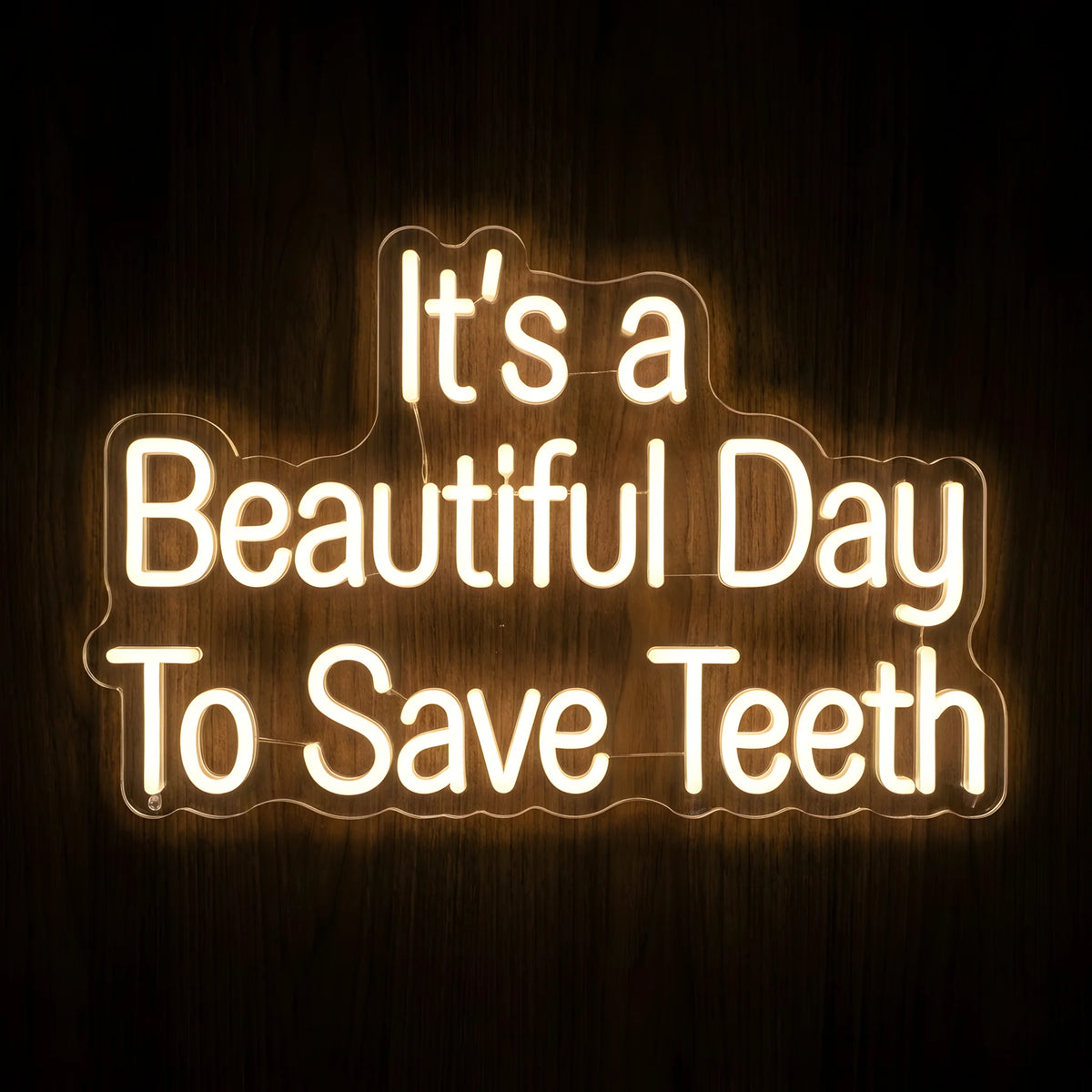 It's a Beautiful Day to Save Teeth LED neon sign featuring warm white illuminated quote lettering on clear acrylic backing for dental clinic, dentist office, and dental treatment room wall decor.