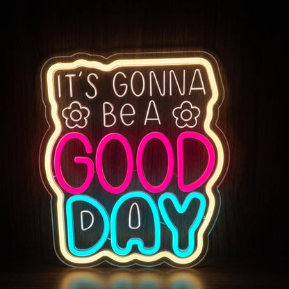 It's Gonna Be a Good Day LED neon sign with pink and blue lettering, warm white border and flower accents.
