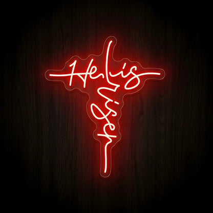 He Is Risen LED neon sign featuring elegant script forming a cross with bright red illumination on a precision-cut clear acrylic backing for Christian wall decor.