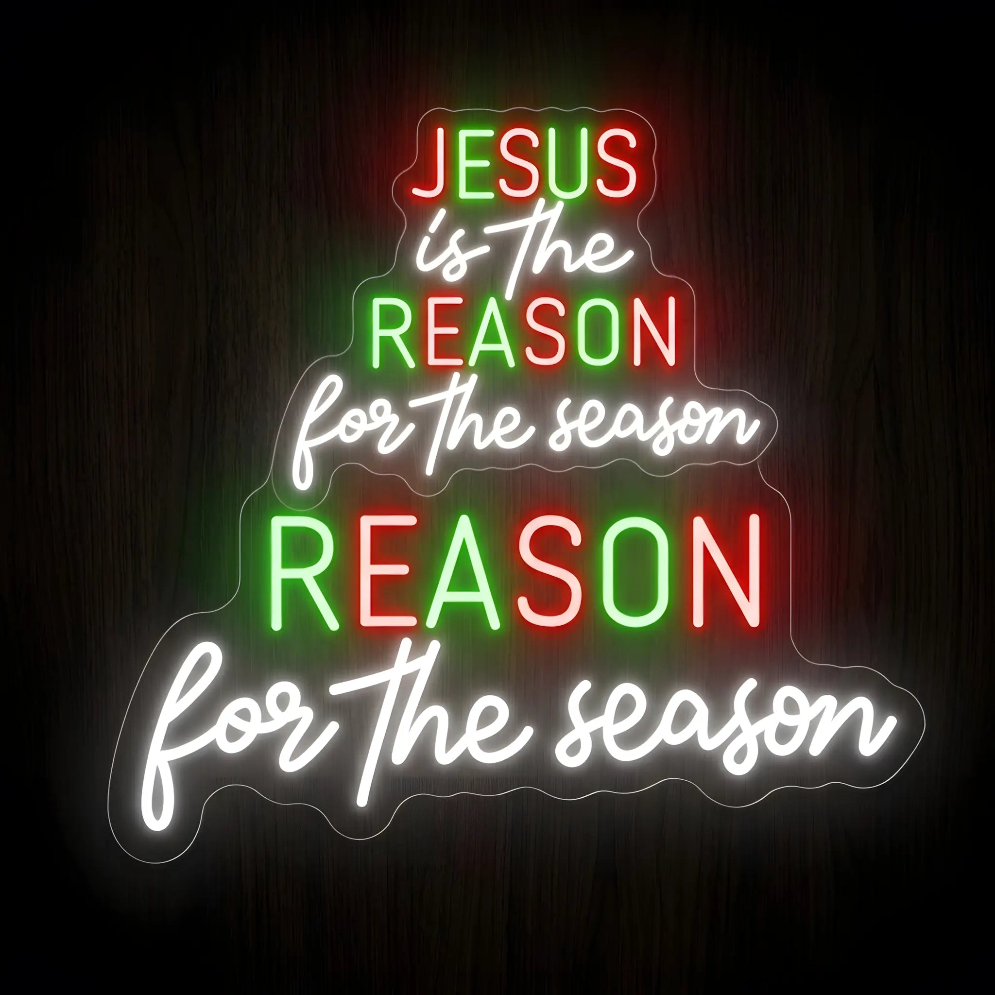 Jesus Is The Reason LED Neon Sign in red, green, and cool white on a precision-cut clear acrylic backing for Christian faith wall decor.