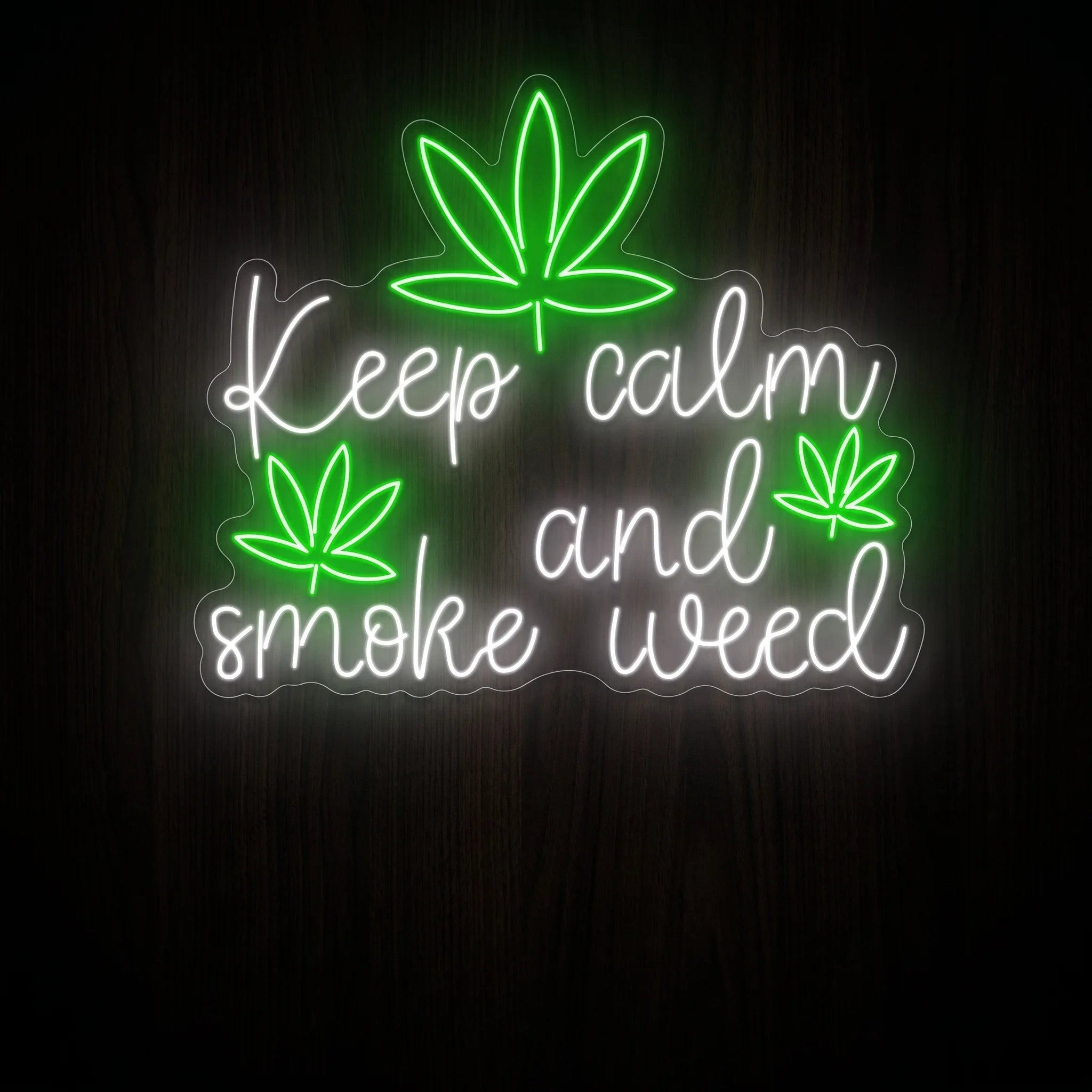 Keep Calm and Smoke Weed LED neon sign featuring white script lettering with green cannabis leaves on a clear acrylic backing.