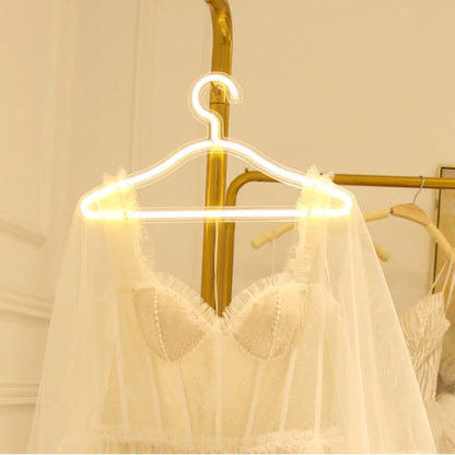 LED Clothes hanger holding dress