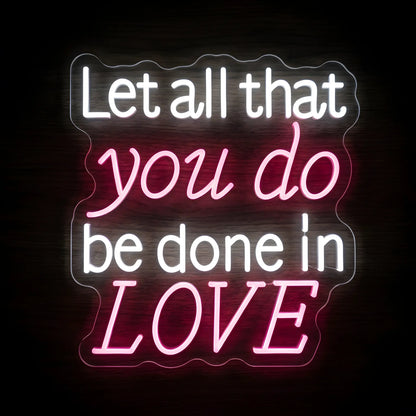 Let All That You Do Be Done in Love LED neon sign featuring white and pink illuminated lettering inspired by 1 Corinthians 16:14 on a precision-cut clear acrylic backing.