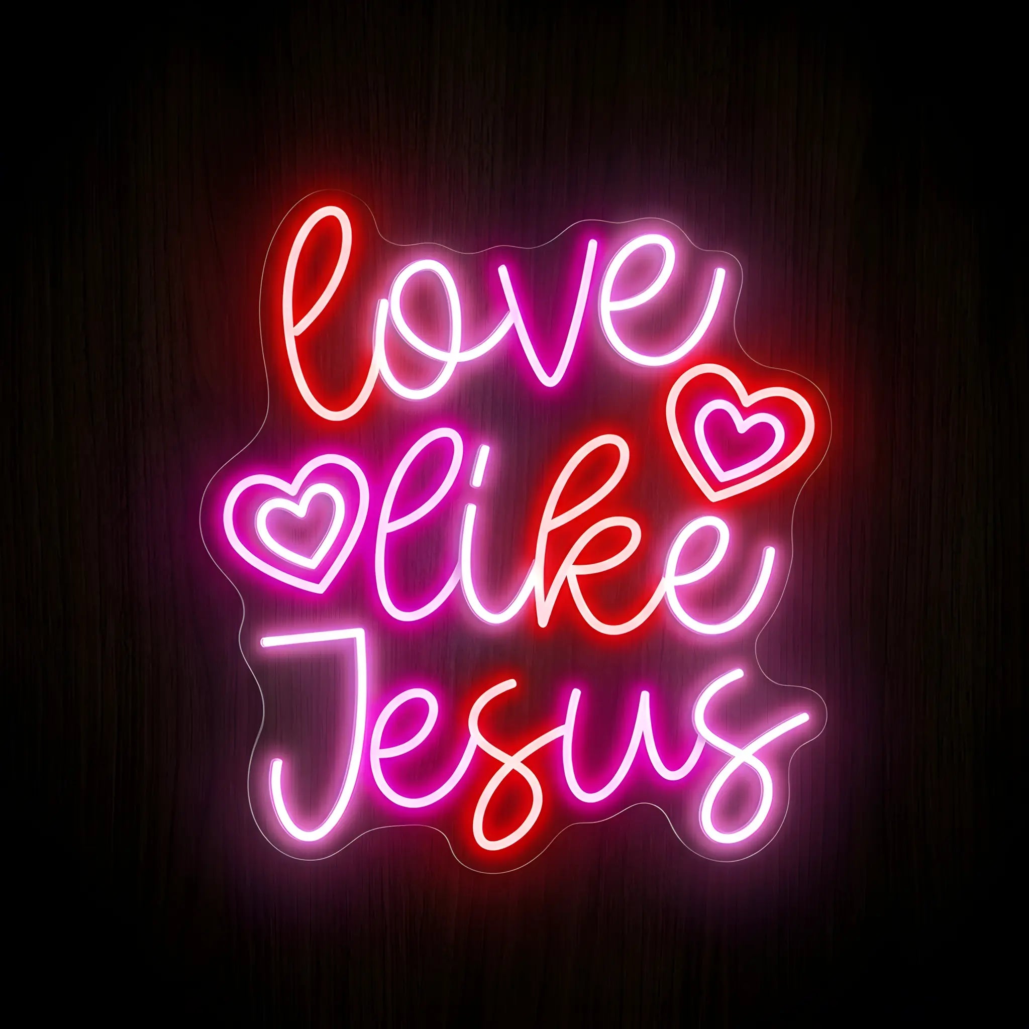 Love Like Jesus LED neon sign featuring pink, red, and white illuminated script lettering with heart accents on a precision-cut clear acrylic backing for Christian wall decor.