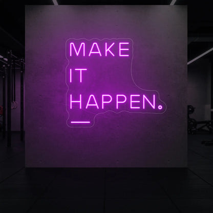  'MAKE IT HAPPEN' neon sign glowing in deep pink against a styled interior wall.