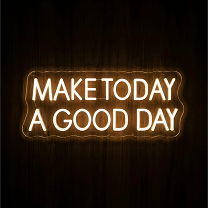 Make Today a Good Day LED Neon Sign with warm white uppercase lettering on clear acrylic against a dark wood background, suited to bedrooms and home offices.