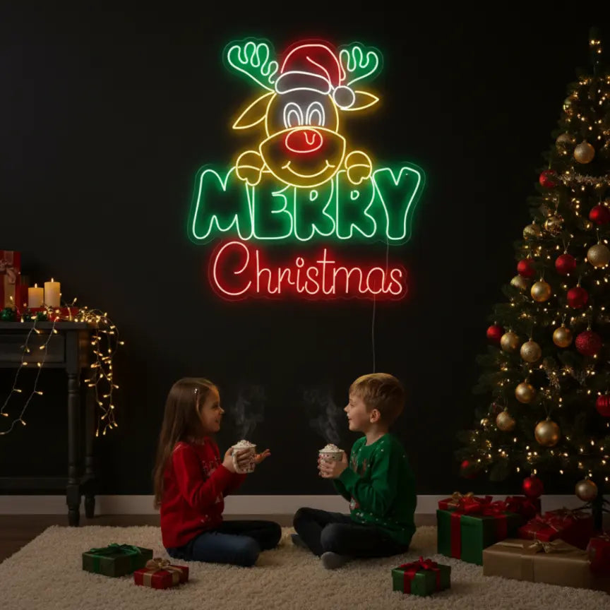Photo of the 'Merry Christmas with Rudolph the Reindeer' neon sign glowing against a styled interior wall.
