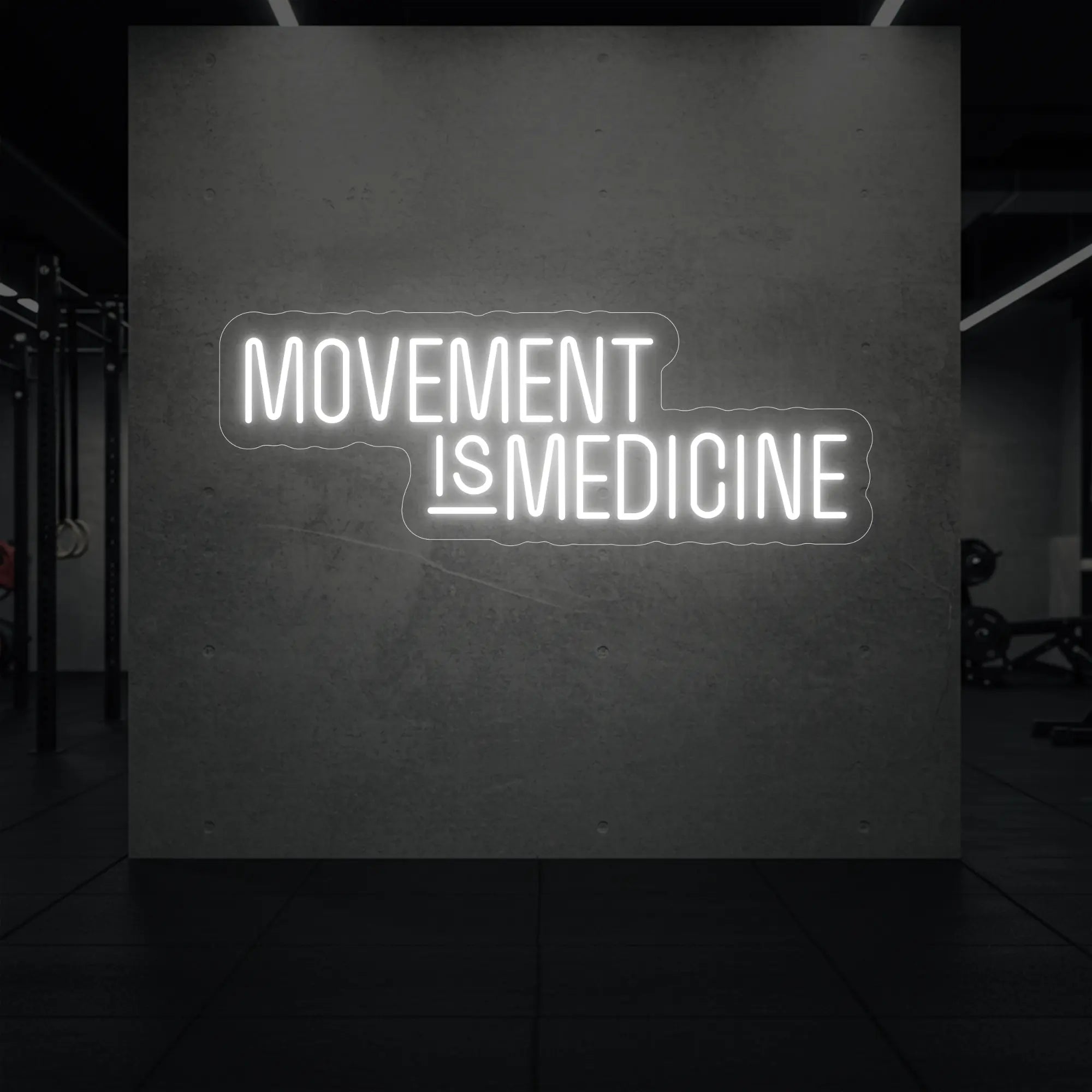  'Movement Is Medicine' neon sign glowing in cool white against a styled interior wall.
