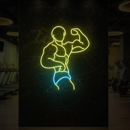 'Muscle Man Side Pose' in lemon yellow and ice blue neon against a styled interior wall.