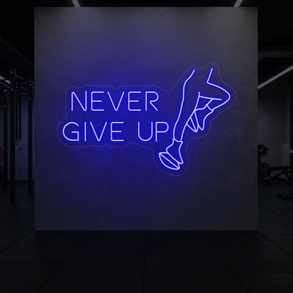  'NEVER GIVE UP' neon sign glowing in deep blue against a styled interior wall.