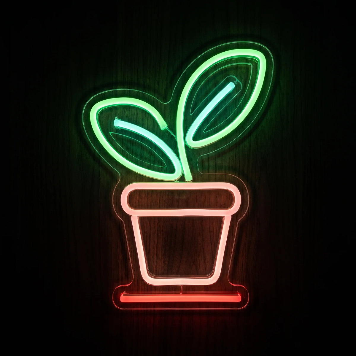 Potted Plant LED Neon Sign featuring two green leaves and a pink and red plant pot on clear acrylic backing.