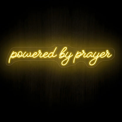 Powered by Prayer LED neon sign with warm golden illumination on precision-cut acrylic backing, Christian wall decor featuring an inspirational faith message.