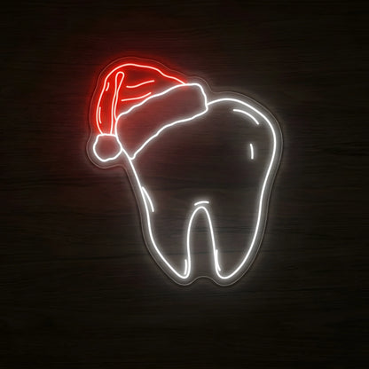 Santa Hat Tooth LED neon sign featuring a glowing cool white tooth wearing a red Santa hat with white trim and pom-pom on clear acrylic backing for Christmas dental office decor.