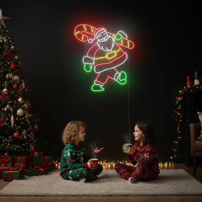 Photo of the 'Santa With Candy Cane' neon sign glowing in multicolor against a styled interior wall.
