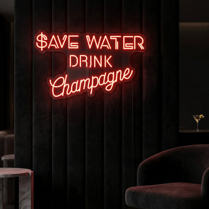 Photo of the 'Save Water Drink Champagne' neon sign glowing in red against a chic champagne bar-inspired wall.
