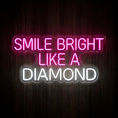Smile Bright Like a Diamond LED neon sign featuring bright pink SMILE BRIGHT LIKE A lettering and cool white DIAMOND text on clear acrylic backing for dental clinic wall decor.