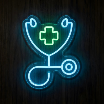 Stethoscope Medical Cross LED Neon Sign featuring a glowing blue stethoscope surrounding a bright green medical cross on clear cut-to-shape acrylic backing against a dark wooden wall.